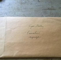 Yellow Envelope of Past Exhibit Photos and Documents